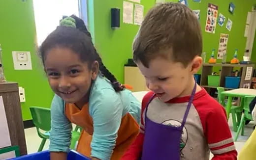 a couple of children in a classroom