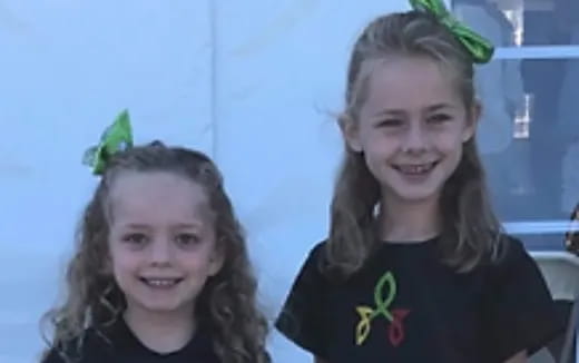 a couple of girls smiling