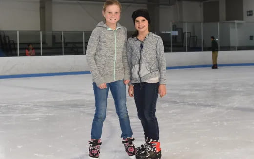a couple of people on ice