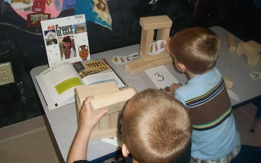 a few children playing with a puzzle