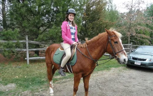 a girl riding a horse
