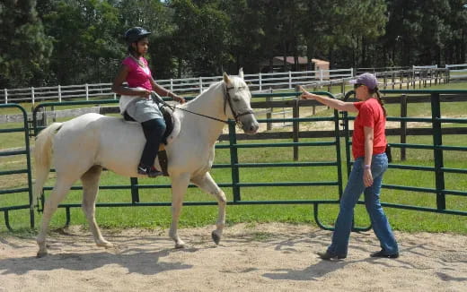 a girl riding a horse