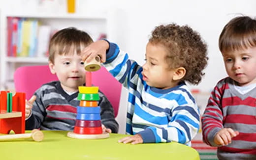 a group of boys playing with toys