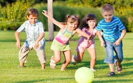 a group of children playing with a ball