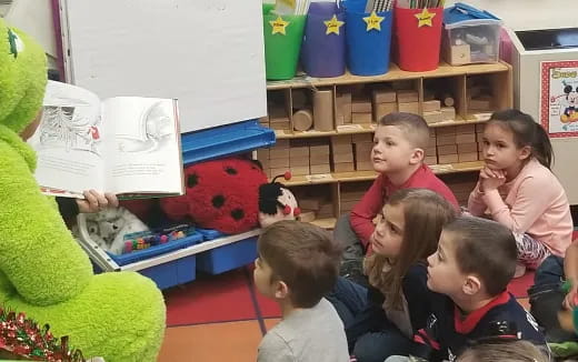 a group of children sitting in a room
