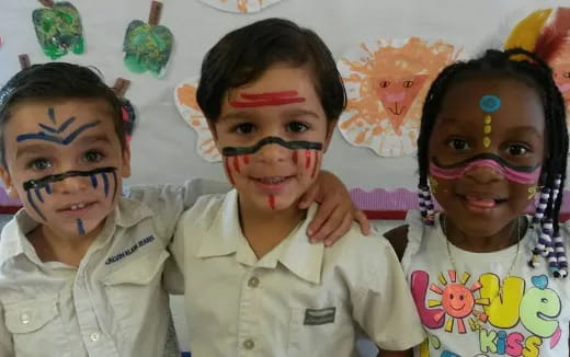 a group of children with face paint