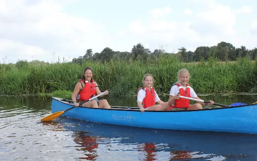 a group of people in a canoe