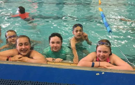 a group of people in a pool