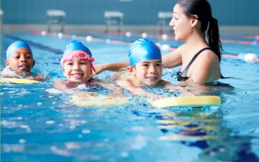 a group of people in a pool