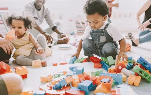 a group of people playing with toys