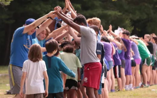 a group of people raising their hands
