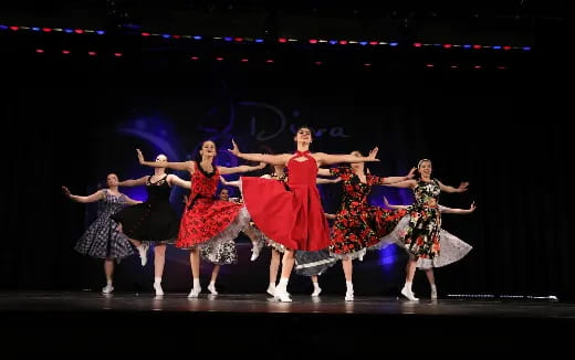 a group of women dancing on a stage