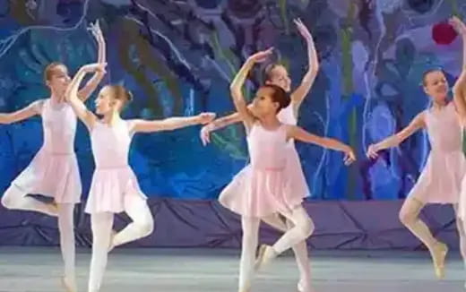 a group of women dancing on a stage