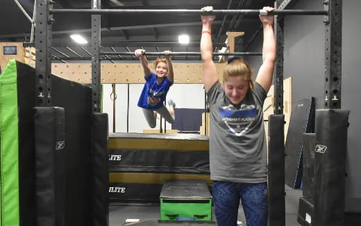 a man and a woman lifting weights