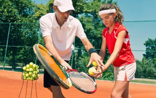 a man and a woman playing tennis