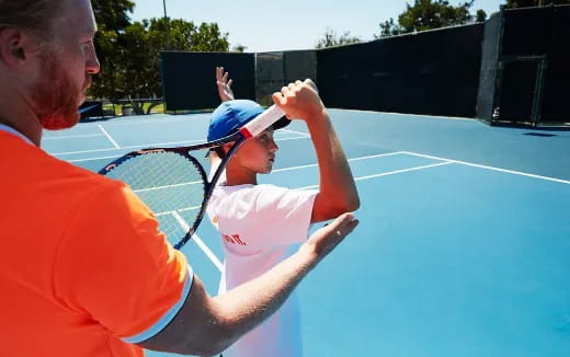 a man and a woman playing tennis