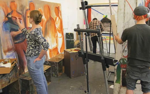 a man and woman looking at a camera
