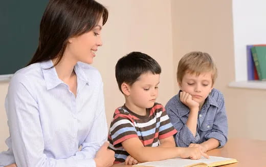 a person and a child looking at a book
