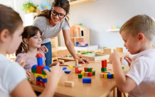 a person and children playing with toys