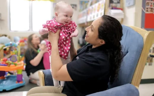a person holding a baby