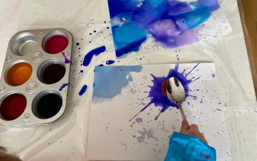 a person painting with a brush
