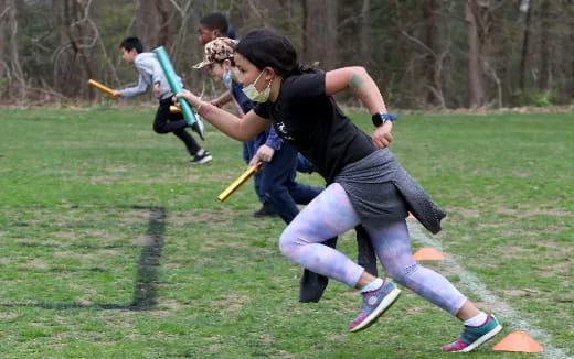 a person playing a game of stickball