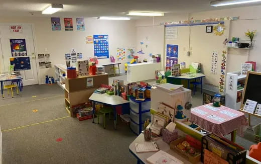 a room with desks and boxes