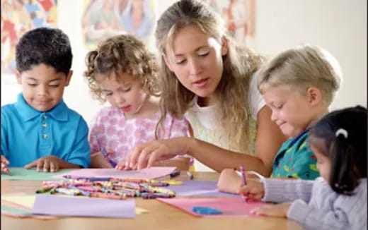 a teacher teaching her students