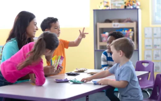 a teacher teaching her students