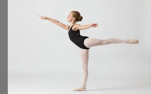 a woman dancing on a white background
