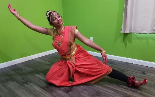 a woman in a red dress dancing