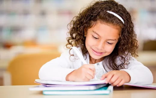 a young girl reading a book