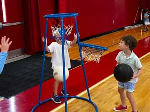 a group of kids playing basketball