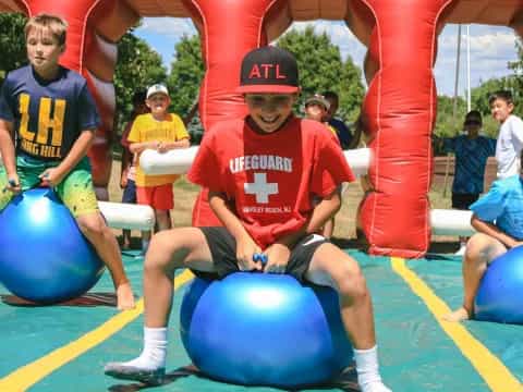 a group of people playing with balls