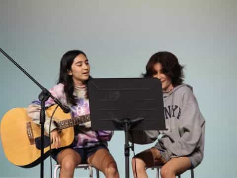 a couple of women playing instruments