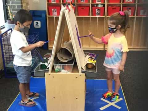 a couple of children playing with toys