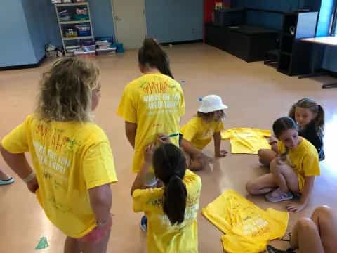 a group of children sitting on the floor