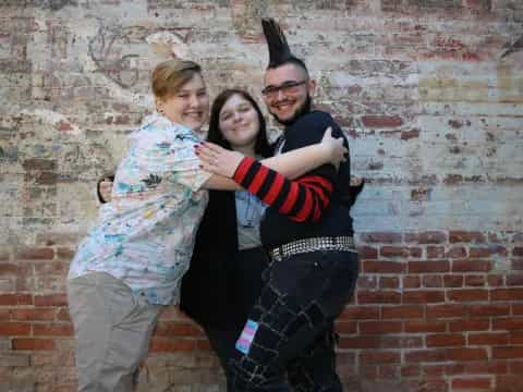 a person and two women posing for a photo