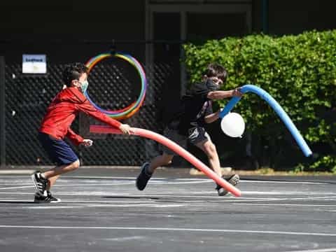a couple of people playing ping pong
