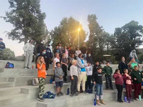 a group of people posing for a photo on some steps