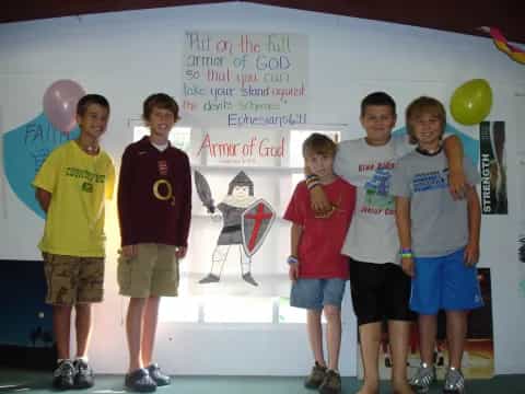 a group of boys posing for a photo