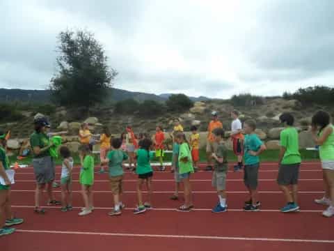 a group of people standing on a track