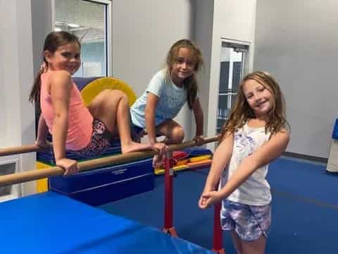 a group of girls playing on a trampoline