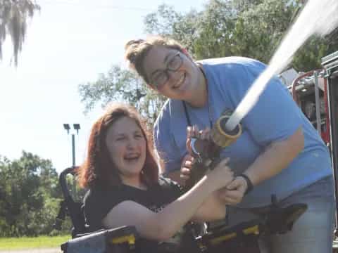 a man and woman posing for a picture with a gun