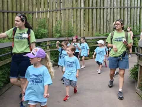 a group of people walking on a path