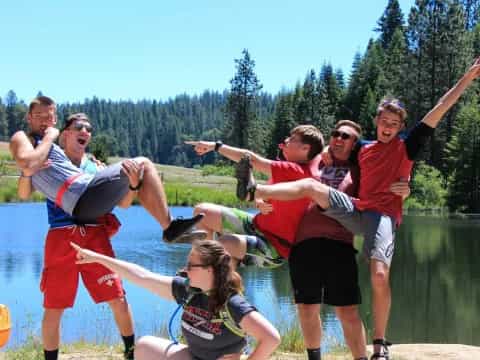 a group of people jumping into the water