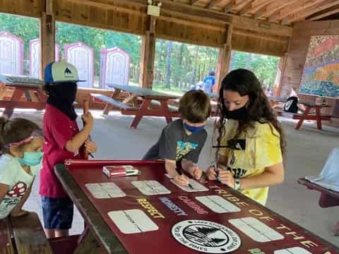 a group of children playing a board game