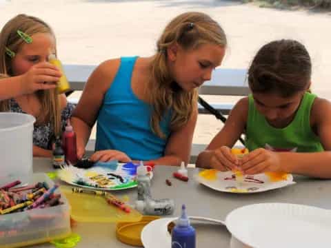a group of girls eating at a table