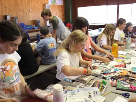 a group of children sitting at a table