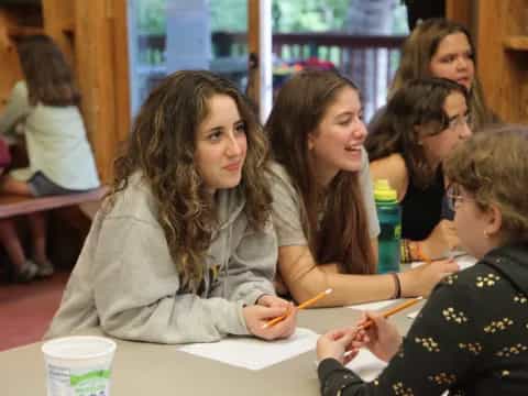 a group of women sitting at a table